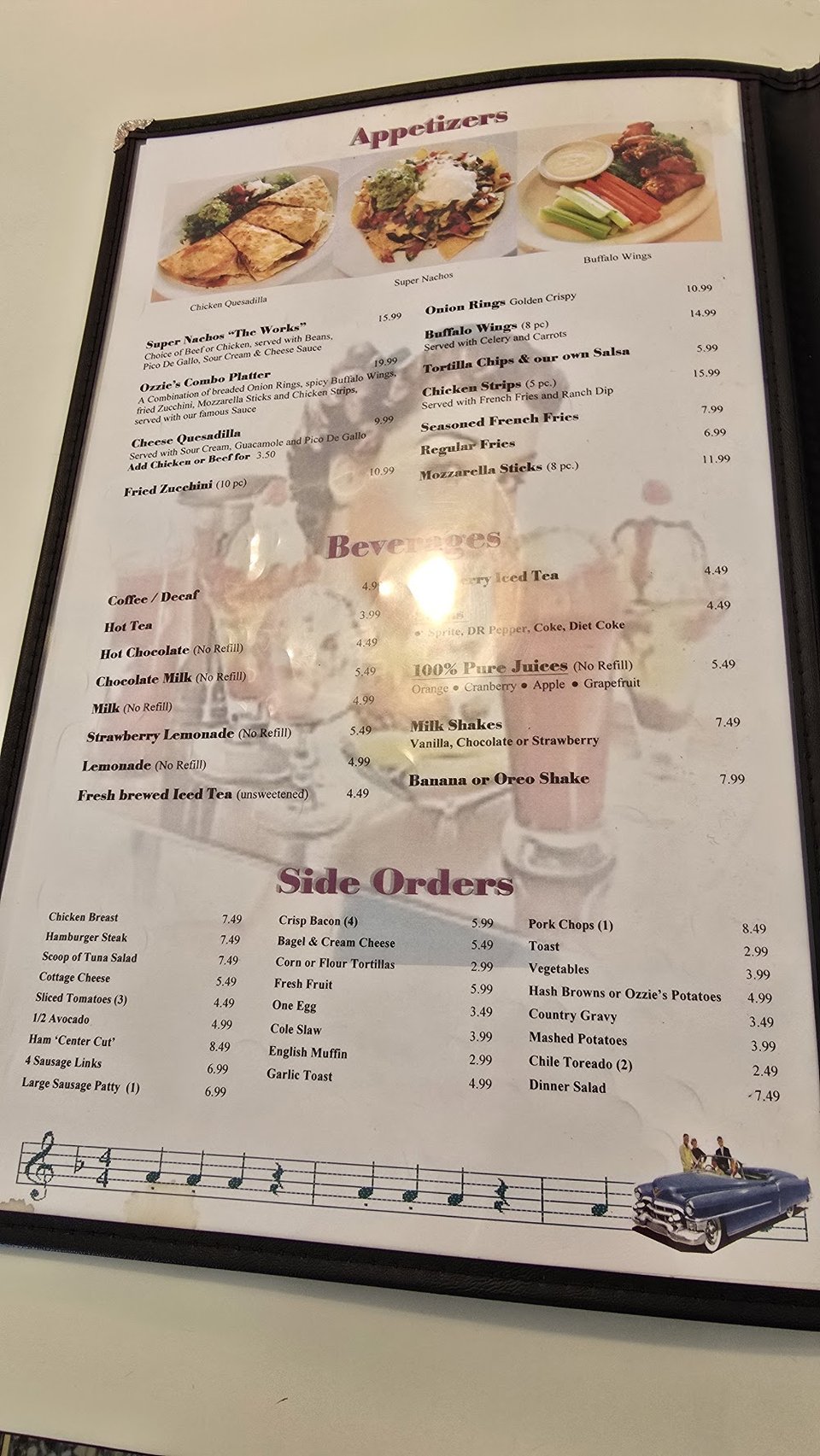 Menu board with breakfast, entrees, and dessert sections.